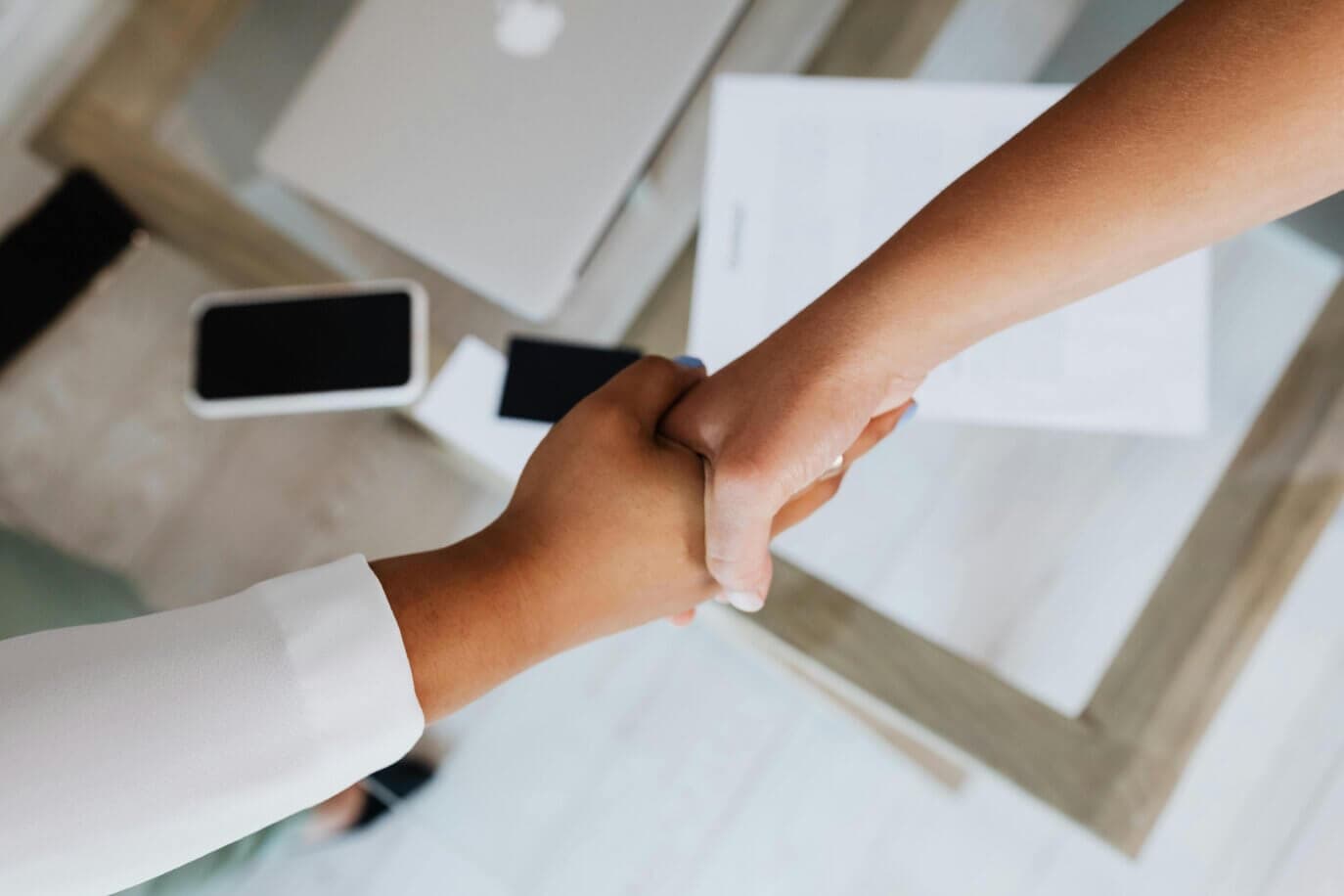 Small business owner reviewing accounts with accountant
